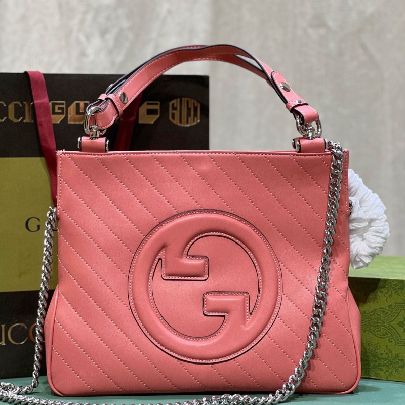 G*u*i shopping bags